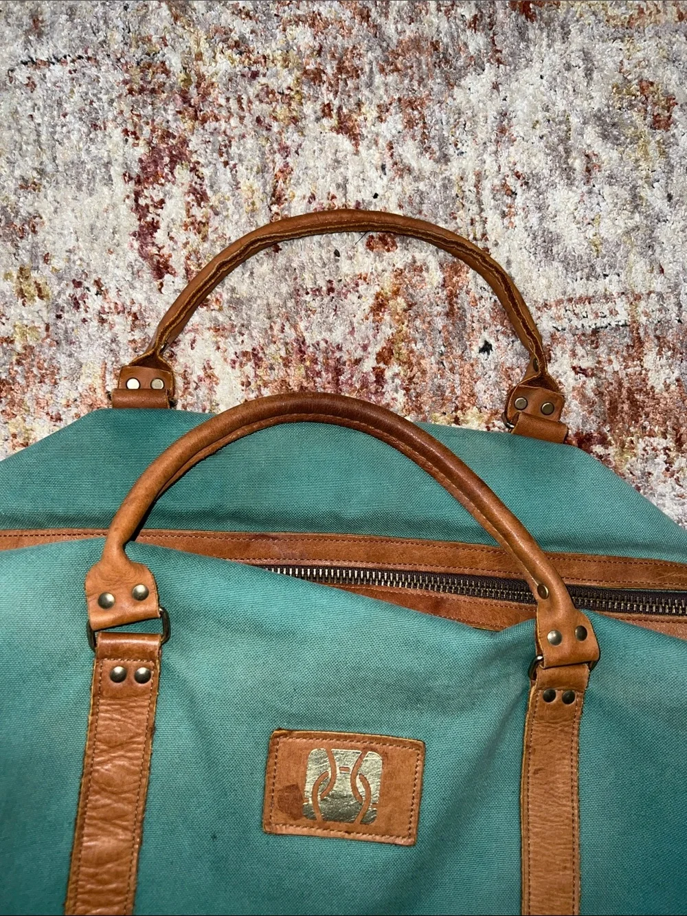 Vintage green duffle bag with leather handles